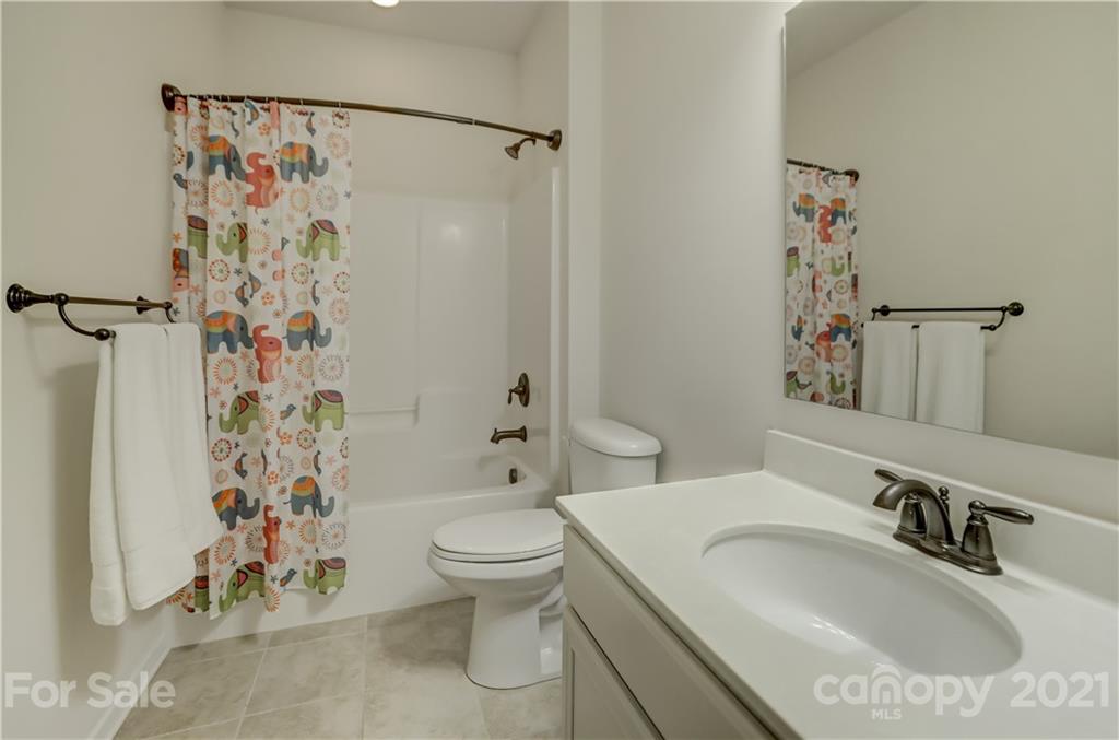 5202 Waterloo Drive Tega Cay, SC 29708 - Photo 33 of 44 a bathroom with a sink toilet and shower