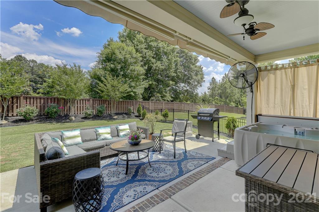 5202 Waterloo Drive Tega Cay, SC 29708 - Photo 35 of 44 a outdoor living space with furniture and a grill