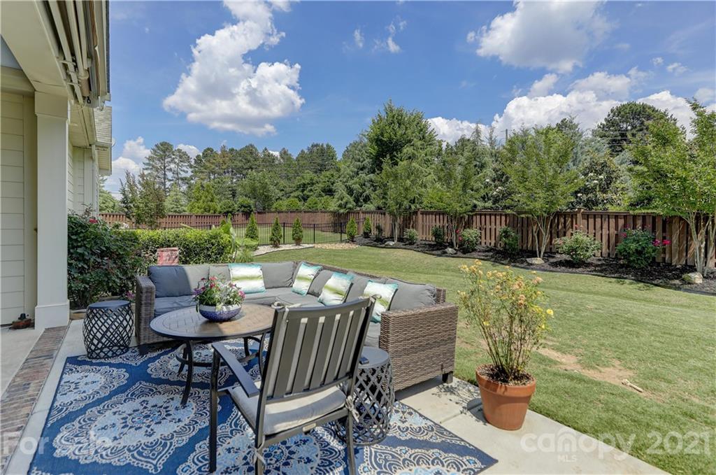 5202 Waterloo Drive Tega Cay, SC 29708 - Photo 36 of 44 a view of a chair and table in the patio