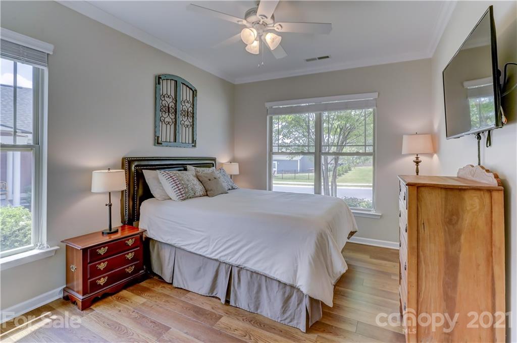 5202 Waterloo Drive Tega Cay, SC 29708 - Photo 8 of 44 a bedroom with a bed a window and dresser