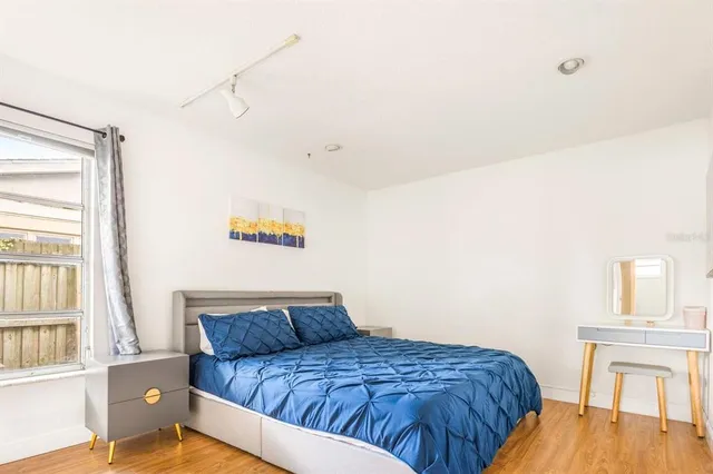 a bedroom with a bed and a table in it