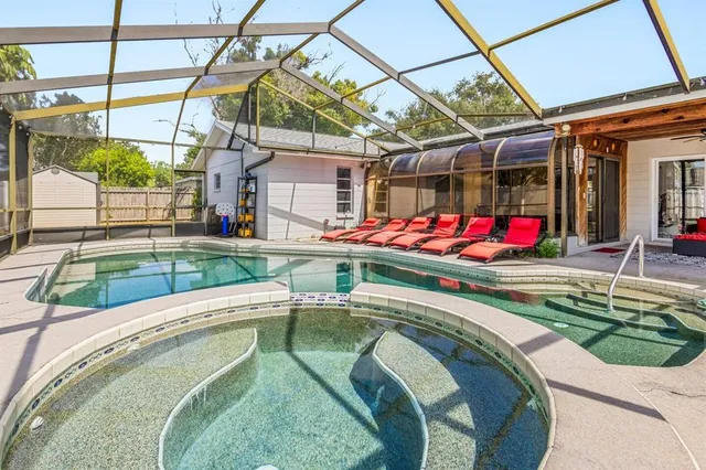 a view of swimming pool with a patio