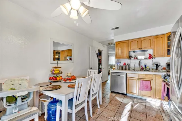 a kitchen with a sink cabinets and window