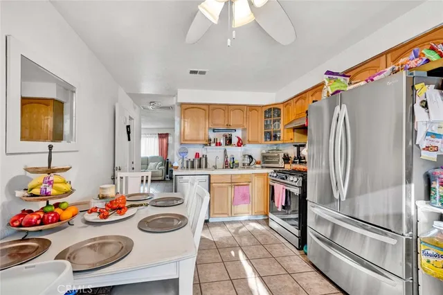 a kitchen with stainless steel appliances a sink and cabinets