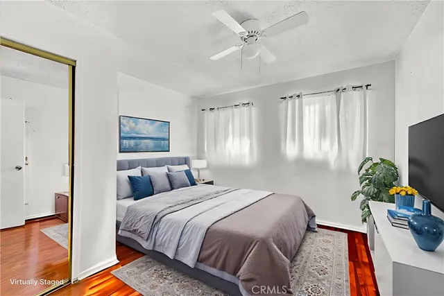 a bedroom with a bed furniture and a window