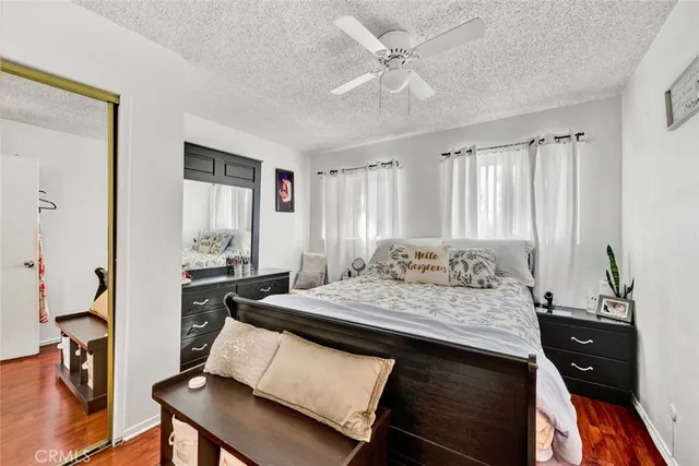 a living room with granite countertop furniture and a flat screen tv