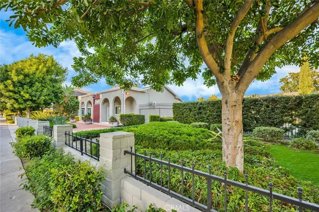 a front view of a house with garden