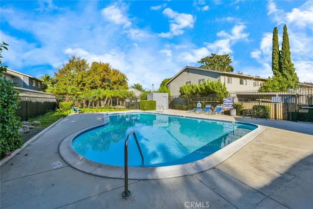 a view of a swimming pool with a patio
