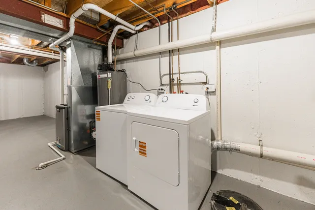 a view of a two chairs in the balcony