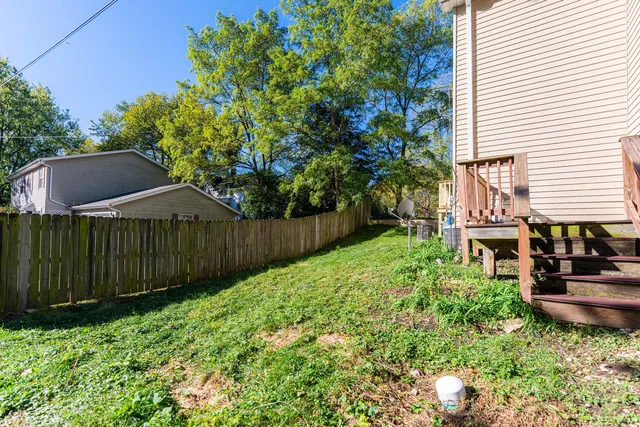a picture of a bench in front of a wall