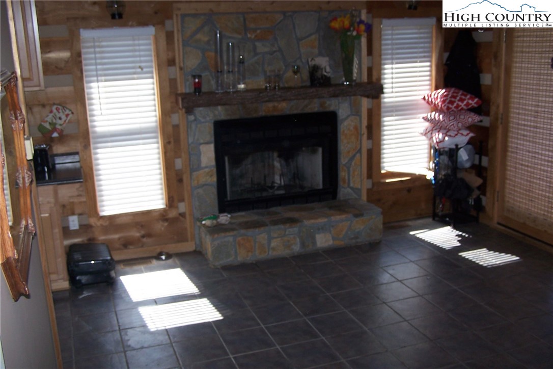 3545 Wildcat Road Deep Gap, NC 28618 - Photo 11 of 24 a living room with furniture and a fireplace