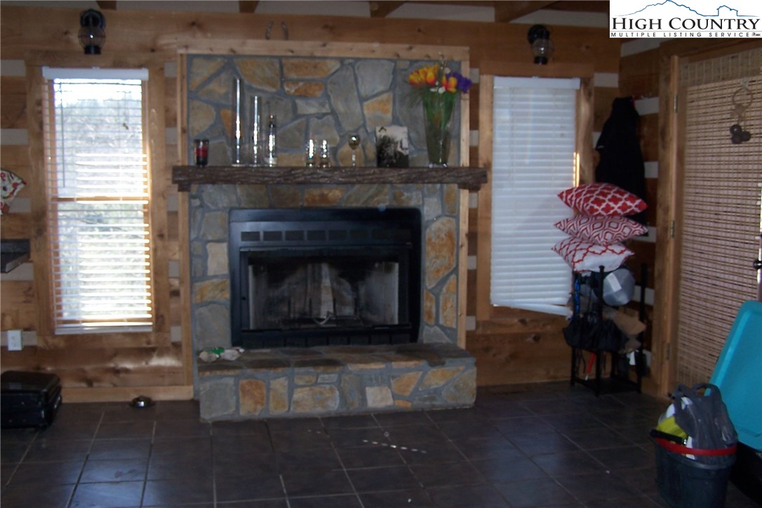3545 Wildcat Road Deep Gap, NC 28618 - Photo 12 of 24 a living room with furniture and a fireplace