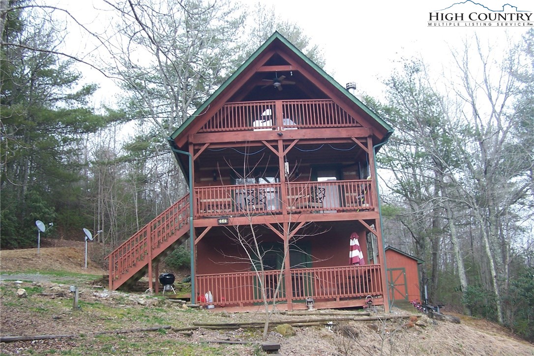 3545 Wildcat Road Deep Gap, NC 28618 - Photo 4 of 24 a front view of a house with garden
