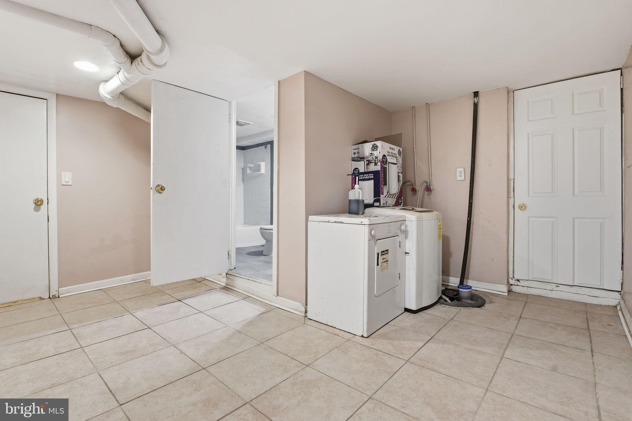 5 South Wickham Road, Unit 1 Baltimore, MD 21229 - Photo 12 of 17 a view of a storage & utility room with two washing machine