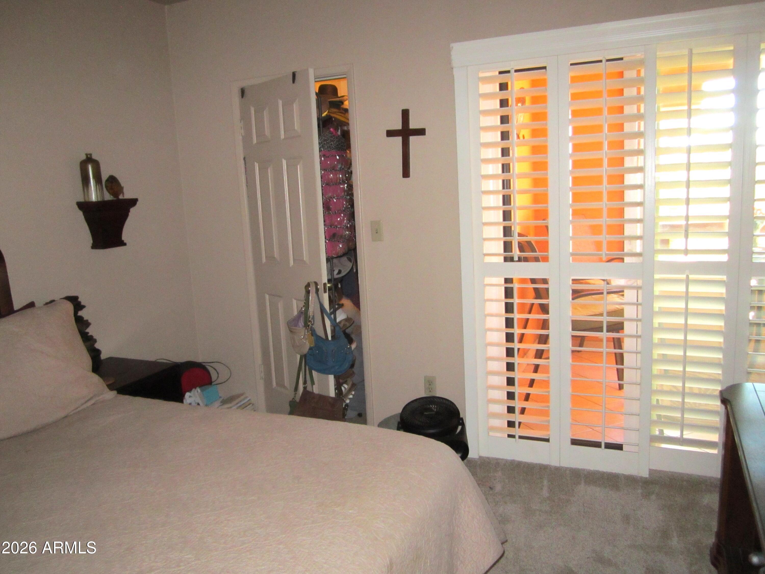 4303 East Cactus Road, Unit 423 Phoenix, AZ 85032 - Photo 13 of 39 a bedroom with a bed and a window