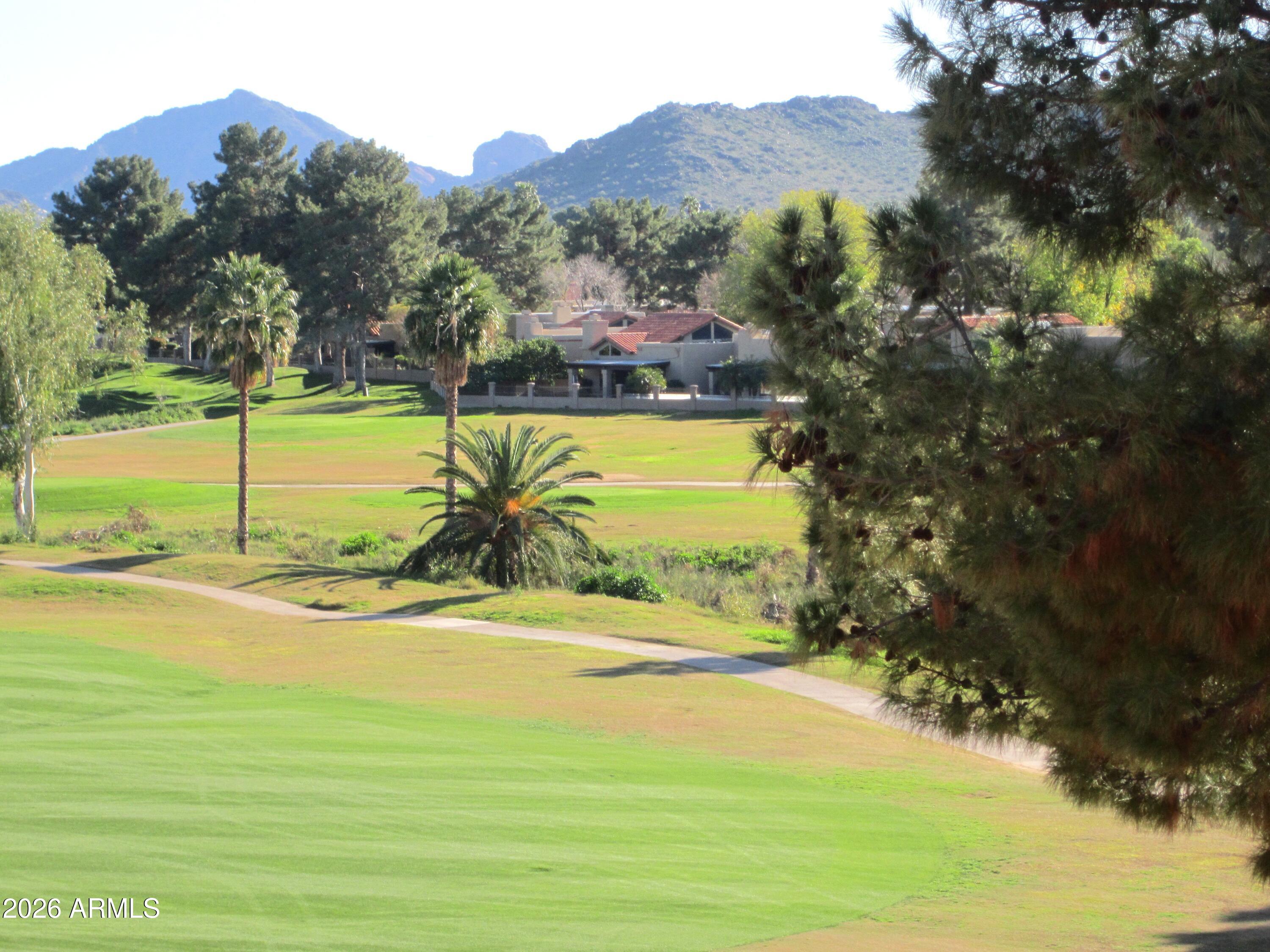 4303 East Cactus Road, Unit 423 Phoenix, AZ 85032 - Photo 16 of 39 a view of a swimming pool with an ocean view