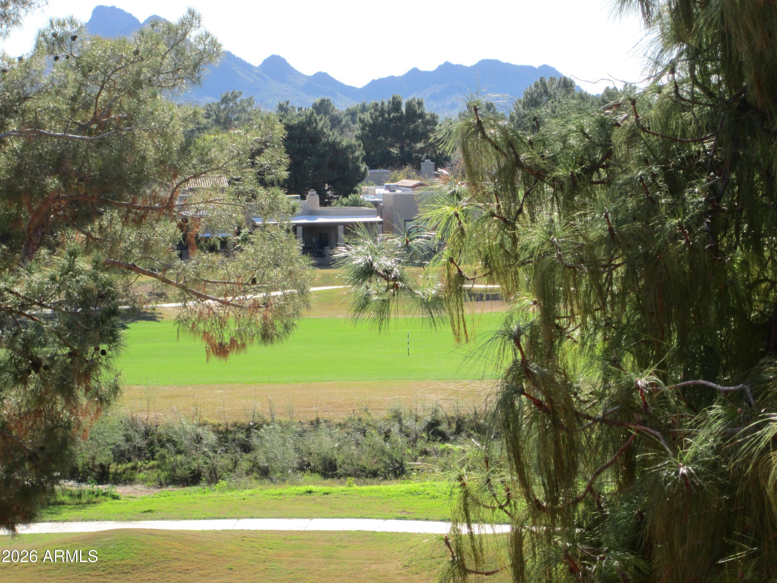 4303 East Cactus Road, Unit 423 Phoenix, AZ 85032 - Photo 17 of 39 a view of a lake with a mountain