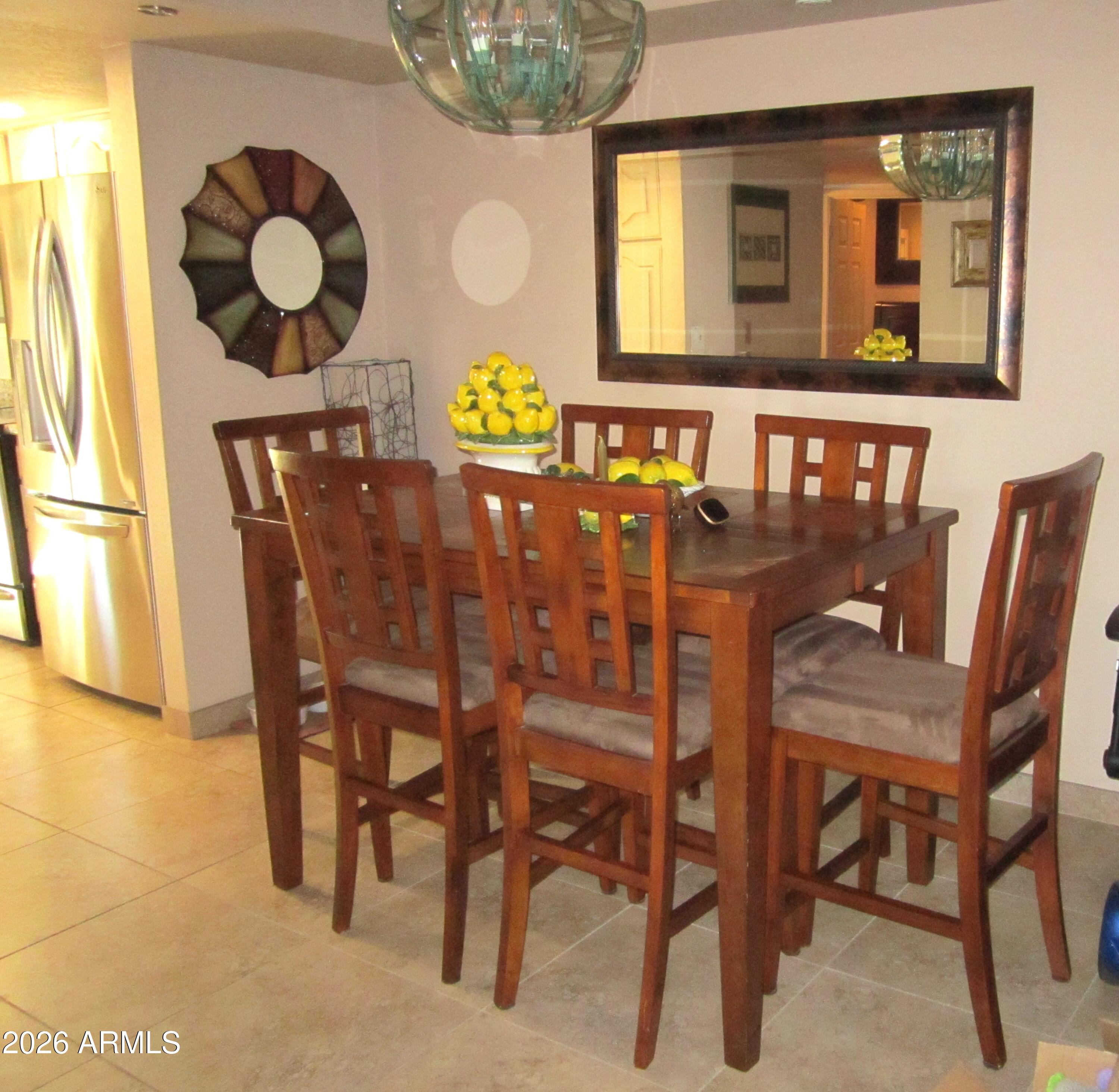 4303 East Cactus Road, Unit 423 Phoenix, AZ 85032 - Photo 4 of 39 a dining room with furniture and window