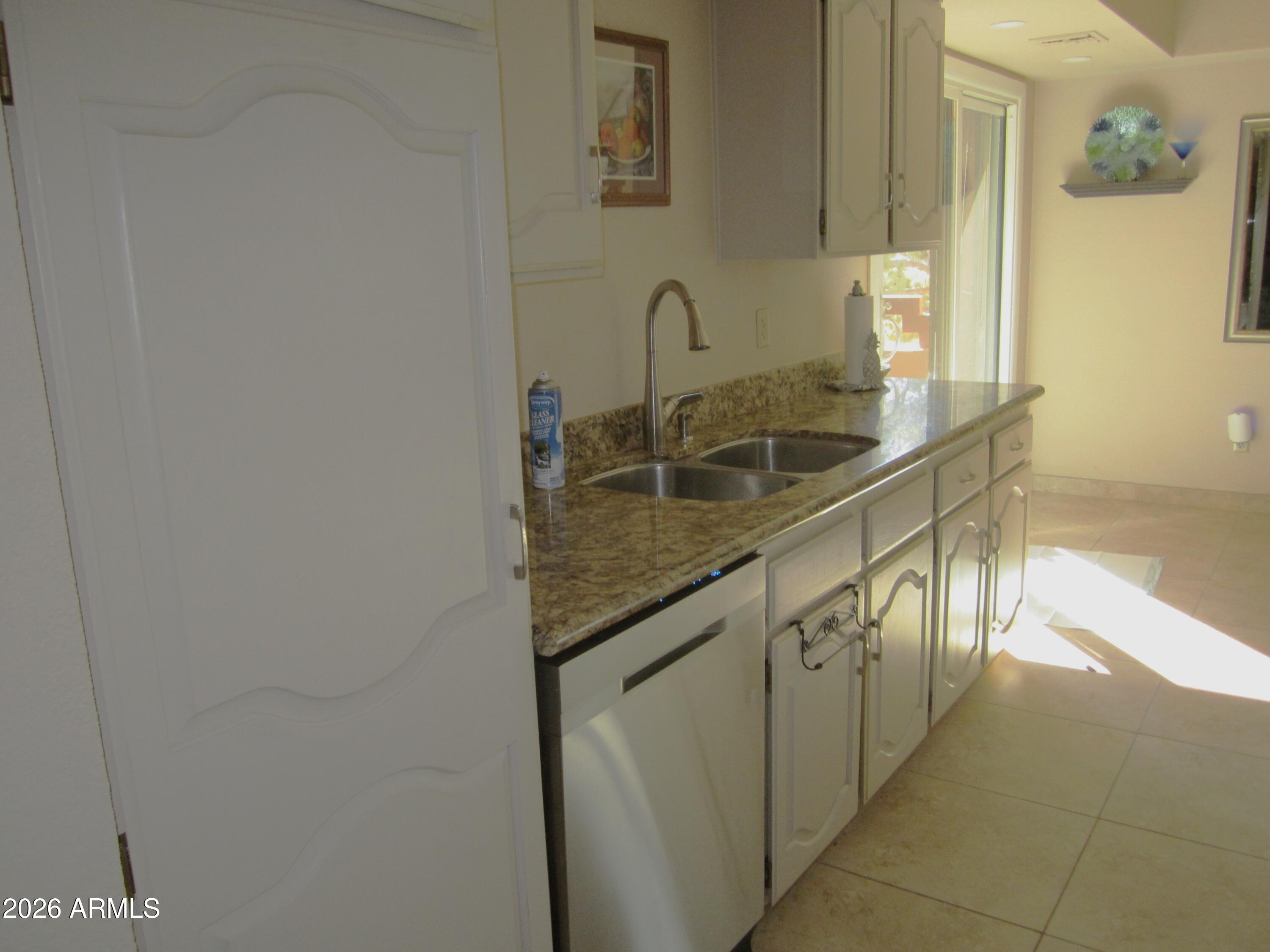 4303 East Cactus Road, Unit 423 Phoenix, AZ 85032 - Photo 5 of 39 a close view of sink and tap