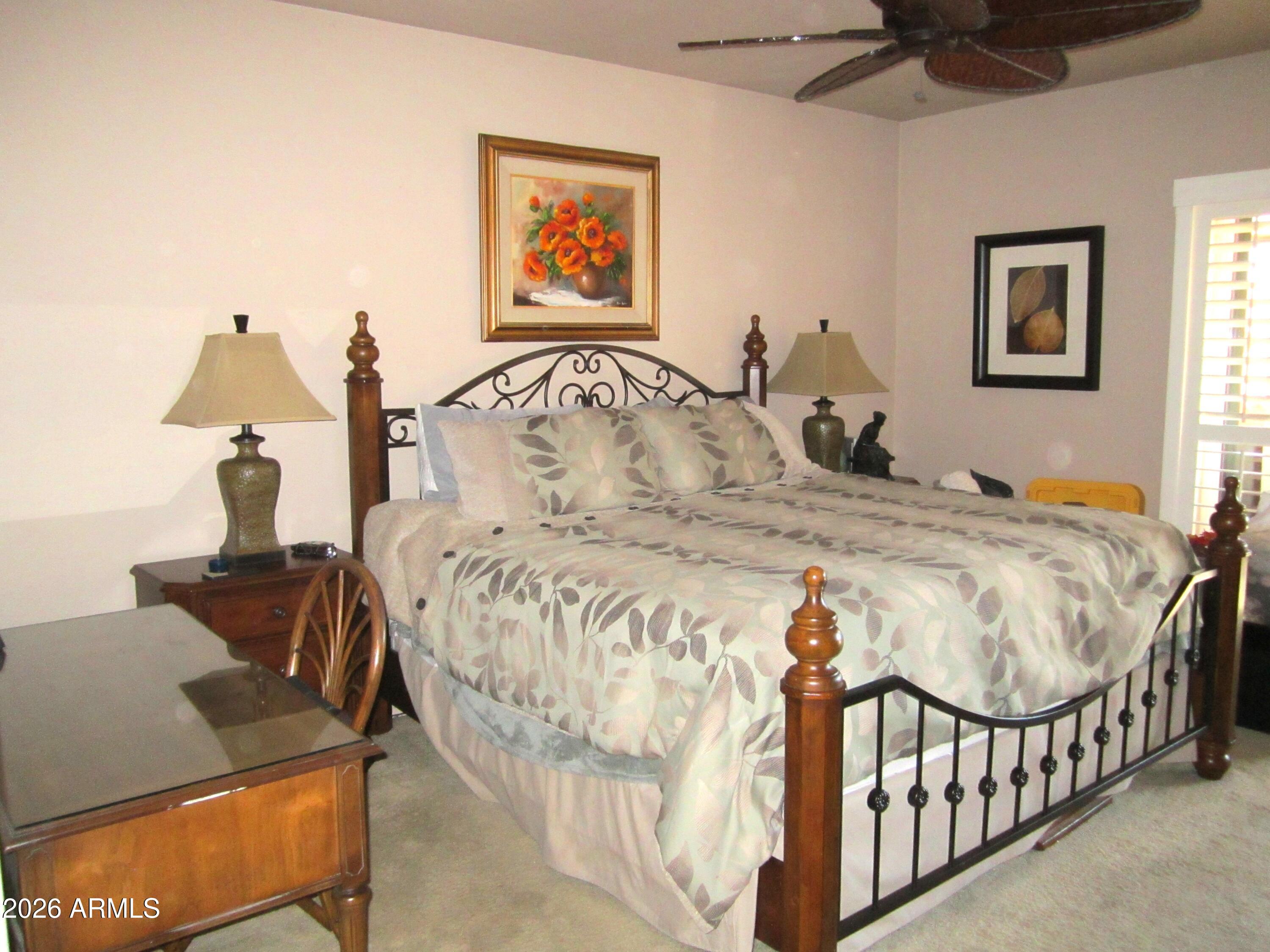 4303 East Cactus Road, Unit 423 Phoenix, AZ 85032 - Photo 10 of 39 a bedroom with bed and a window