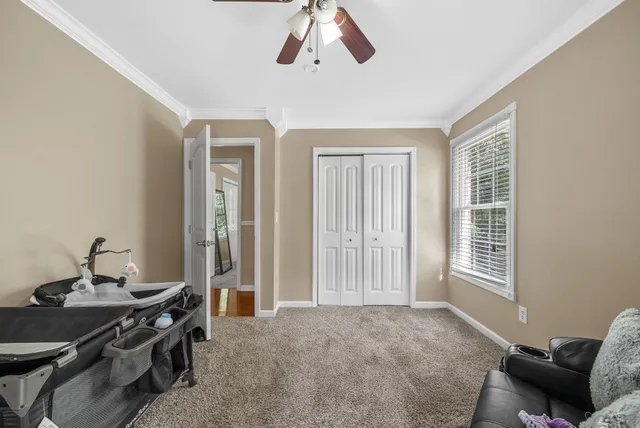 a view of a livingroom with furniture and windows