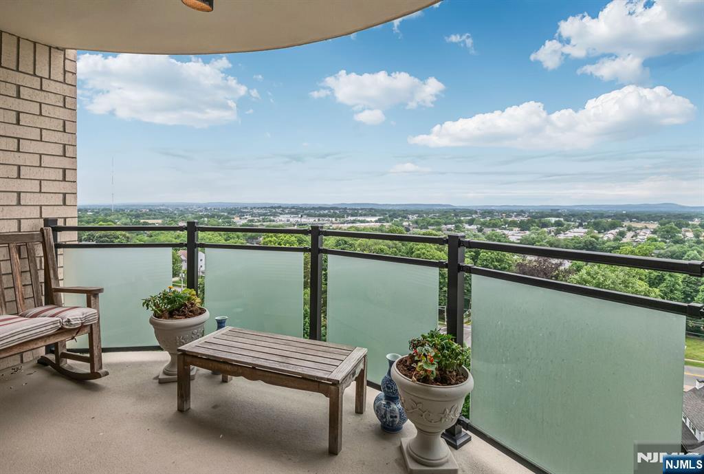 125 Prospect Avenue, Unit 16C Hackensack, NJ 07601 - Photo 14 of 35 a terrace with outdoor seating