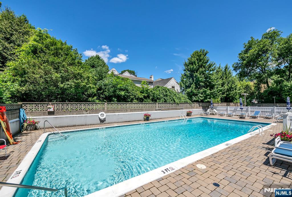 125 Prospect Avenue, Unit 16C Hackensack, NJ 07601 - Photo 35 of 35 a view of a backyard with swimming pool
