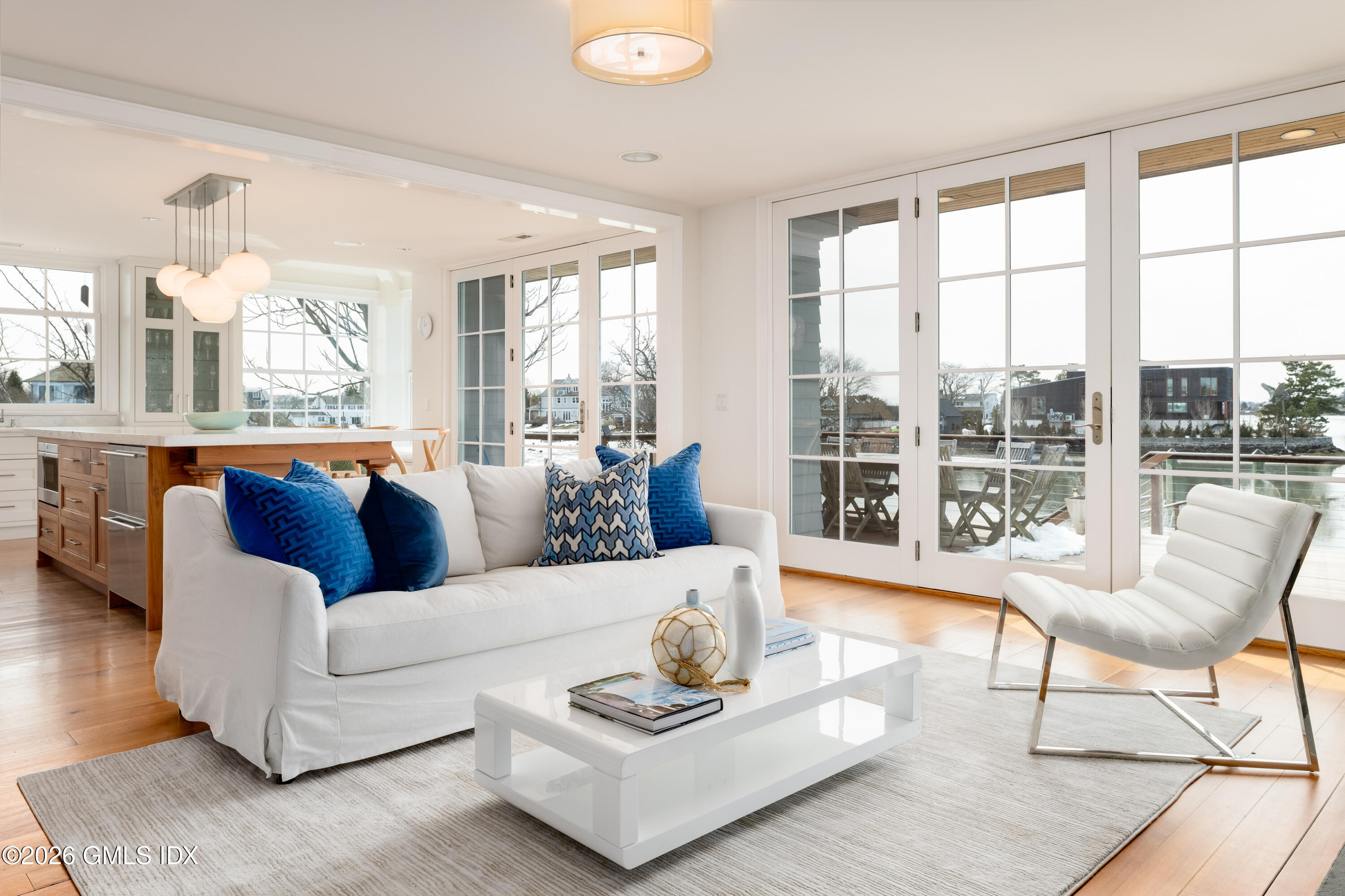 189 Shore Road Old Greenwich, CT 06870 - Photo 6 of 38 a living room with furniture and a large window
