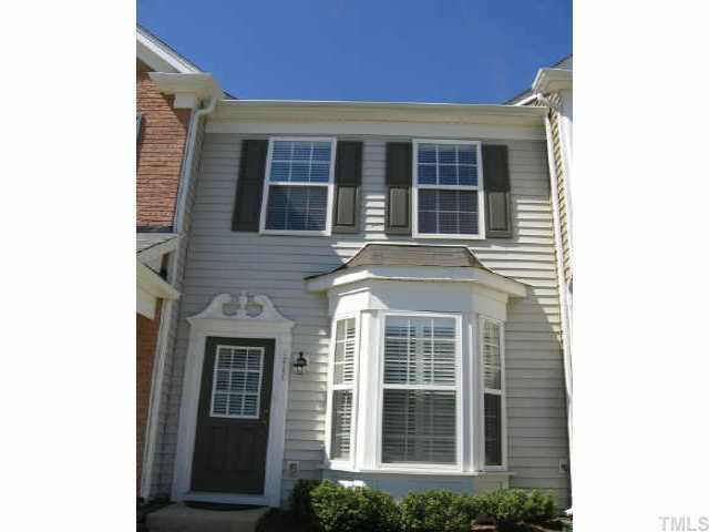 a view of a brick house with a large windows