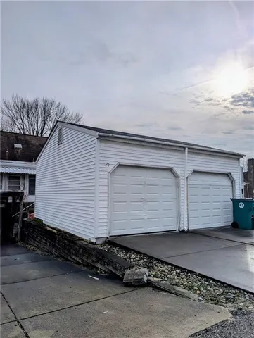 a side view of a house with a garage