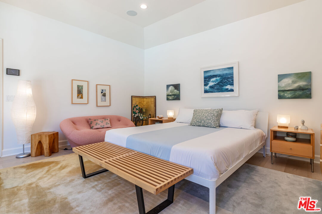 1045 Cold Canyon Road Calabasas, CA 91302 - Photo 27 of 51 a bedroom with bed and a couch