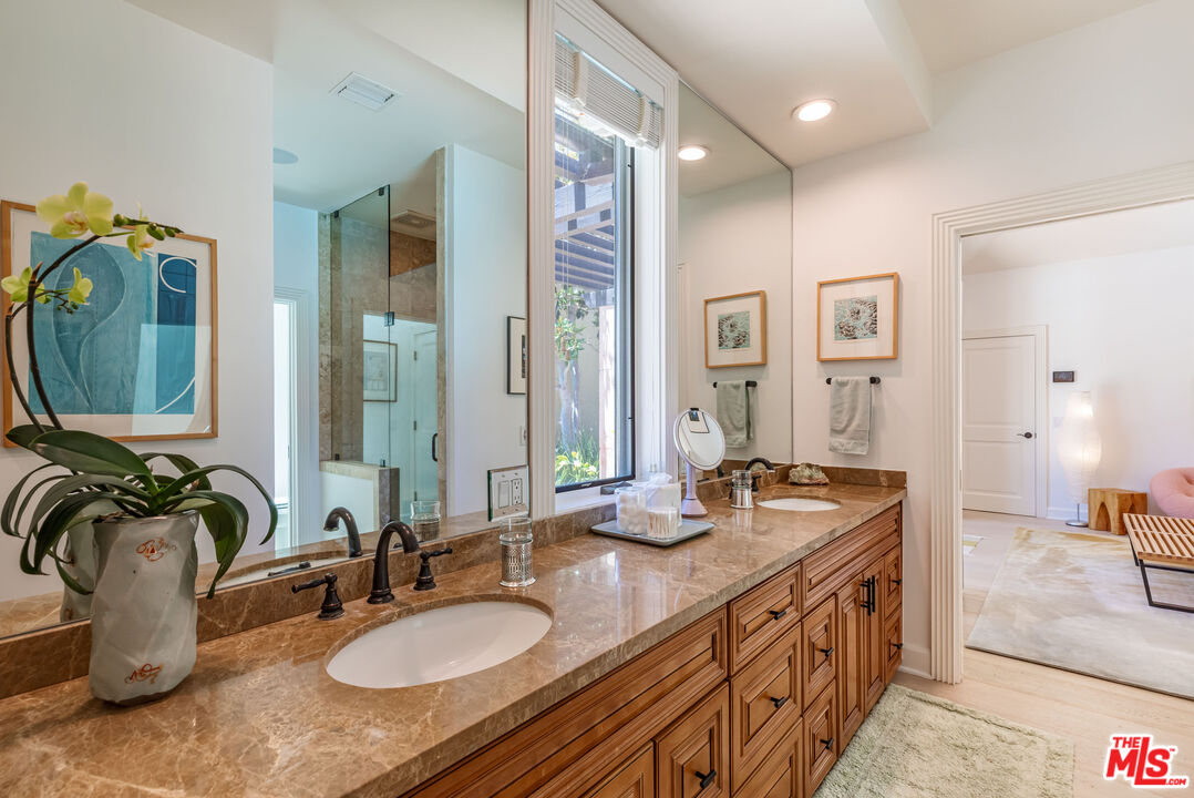 1045 Cold Canyon Road Calabasas, CA 91302 - Photo 28 of 51 a bathroom with sink double vanity