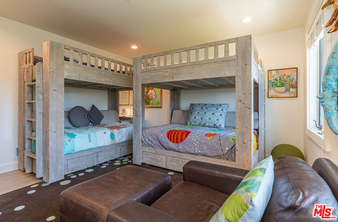 1045 Cold Canyon Road Calabasas, CA 91302 - Photo 39 of 51 a bedroom with a bed and window