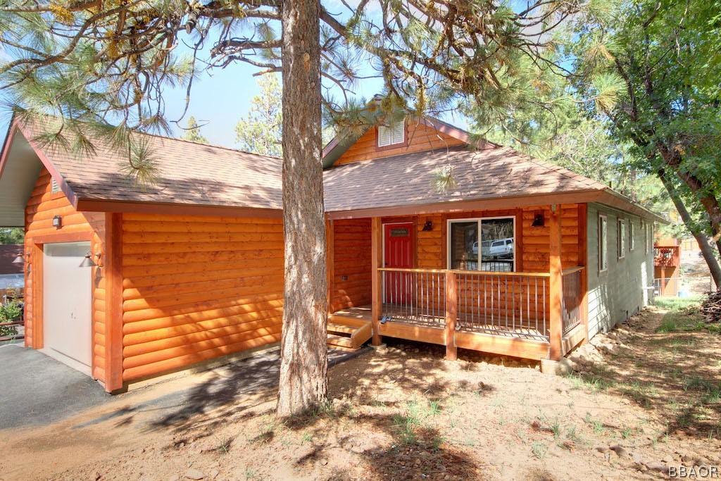 369 Riverside Avenue Sugarloaf, CA 92386 - Photo 1 of 30 a view of a house with a tree in the background