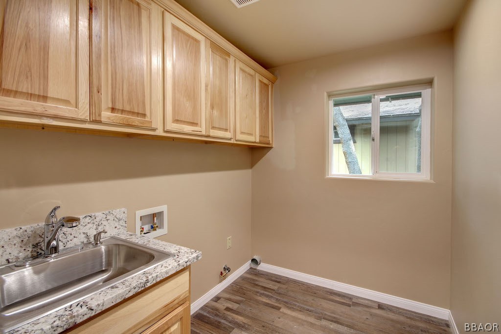 369 Riverside Avenue Sugarloaf, CA 92386 - Photo 14 of 30 a bathroom with a sink and cabinets