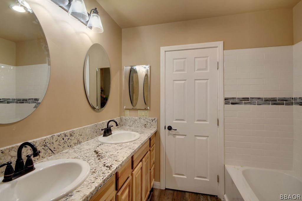 369 Riverside Avenue Sugarloaf, CA 92386 - Photo 21 of 30 a bathroom with a sink and a mirror