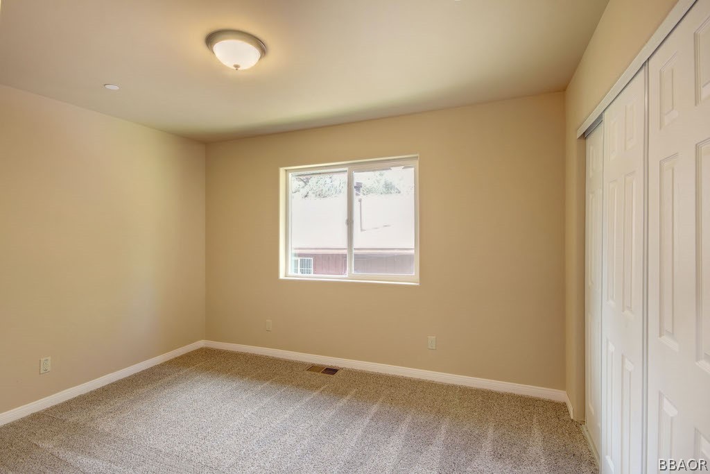 369 Riverside Avenue Sugarloaf, CA 92386 - Photo 23 of 30 an empty room with a window