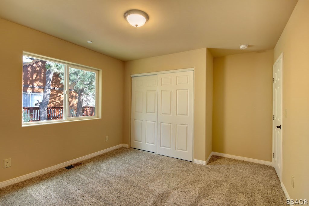 369 Riverside Avenue Sugarloaf, CA 92386 - Photo 28 of 30 an empty room with windows