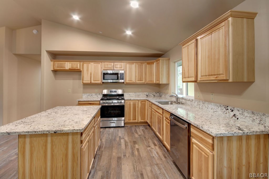 369 Riverside Avenue Sugarloaf, CA 92386 - Photo 8 of 30 a kitchen with a sink stove top oven and cabinets