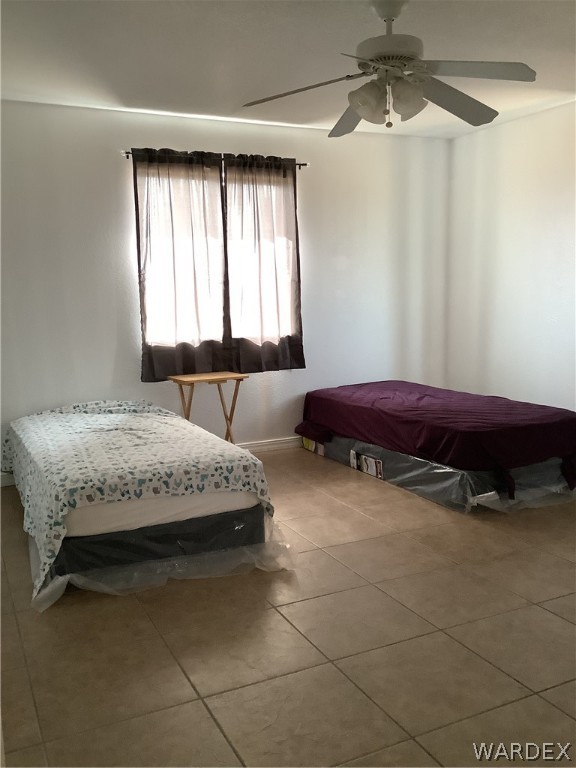 4024 Canelo Road Golden Valley, AZ 86413 - Photo 26 of 35 a bedroom with a bed and a chandelier