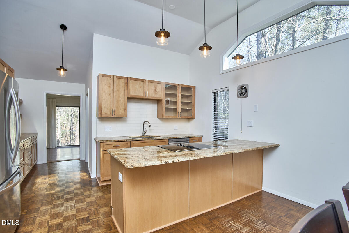 251 Fox Ridge Road Pittsboro, NC 27312 - Photo 15 of 29 a kitchen with stainless steel appliances granite countertop a sink a stove and a wooden floors