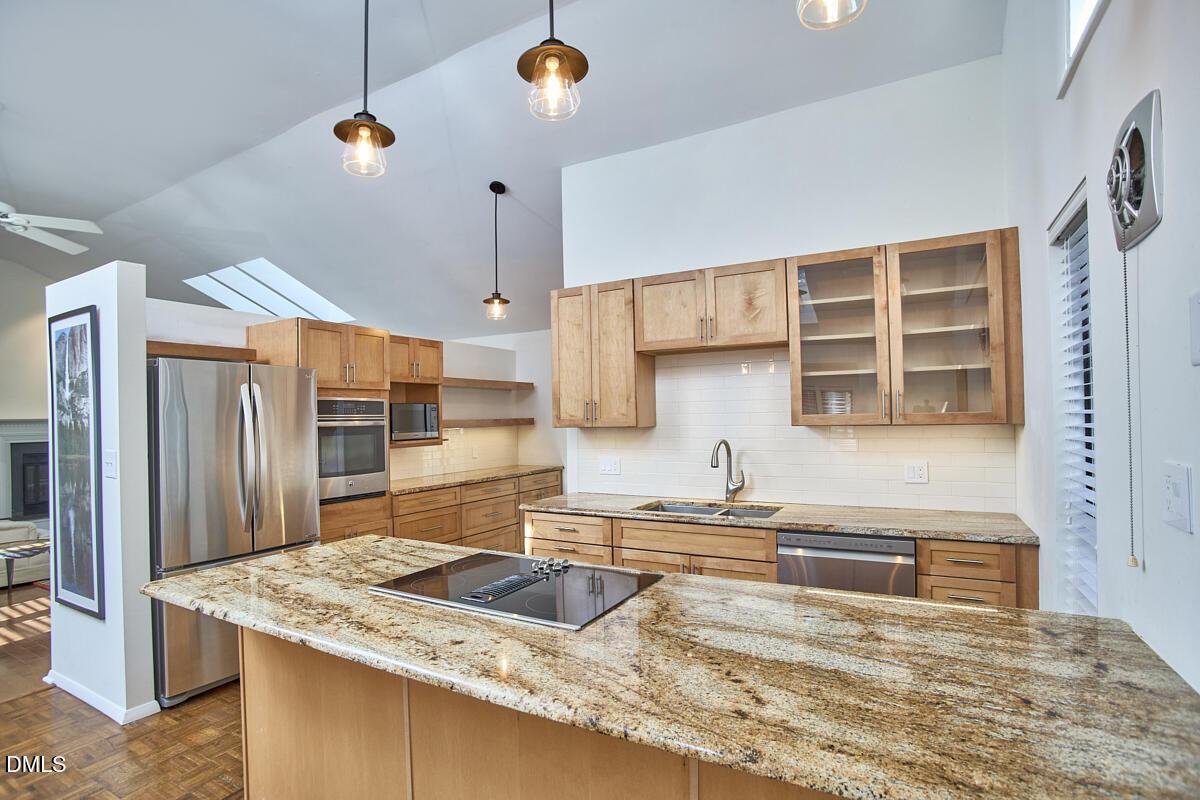 251 Fox Ridge Road Pittsboro, NC 27312 - Photo 16 of 29 a kitchen with stainless steel appliances granite countertop a sink a stove and a refrigerator