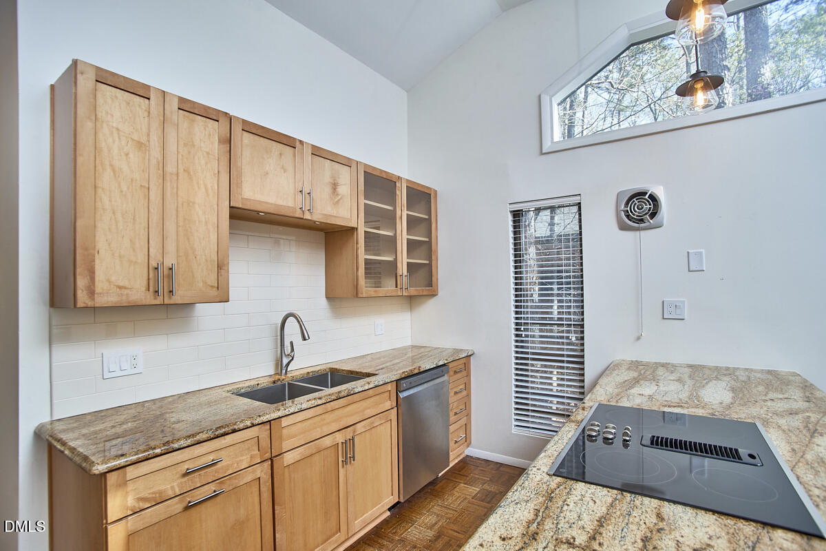 251 Fox Ridge Road Pittsboro, NC 27312 - Photo 17 of 29 a kitchen with stainless steel appliances granite countertop a sink stove and cabinets