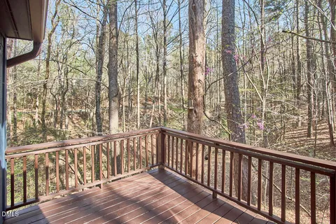 a view of balcony with wooden floor