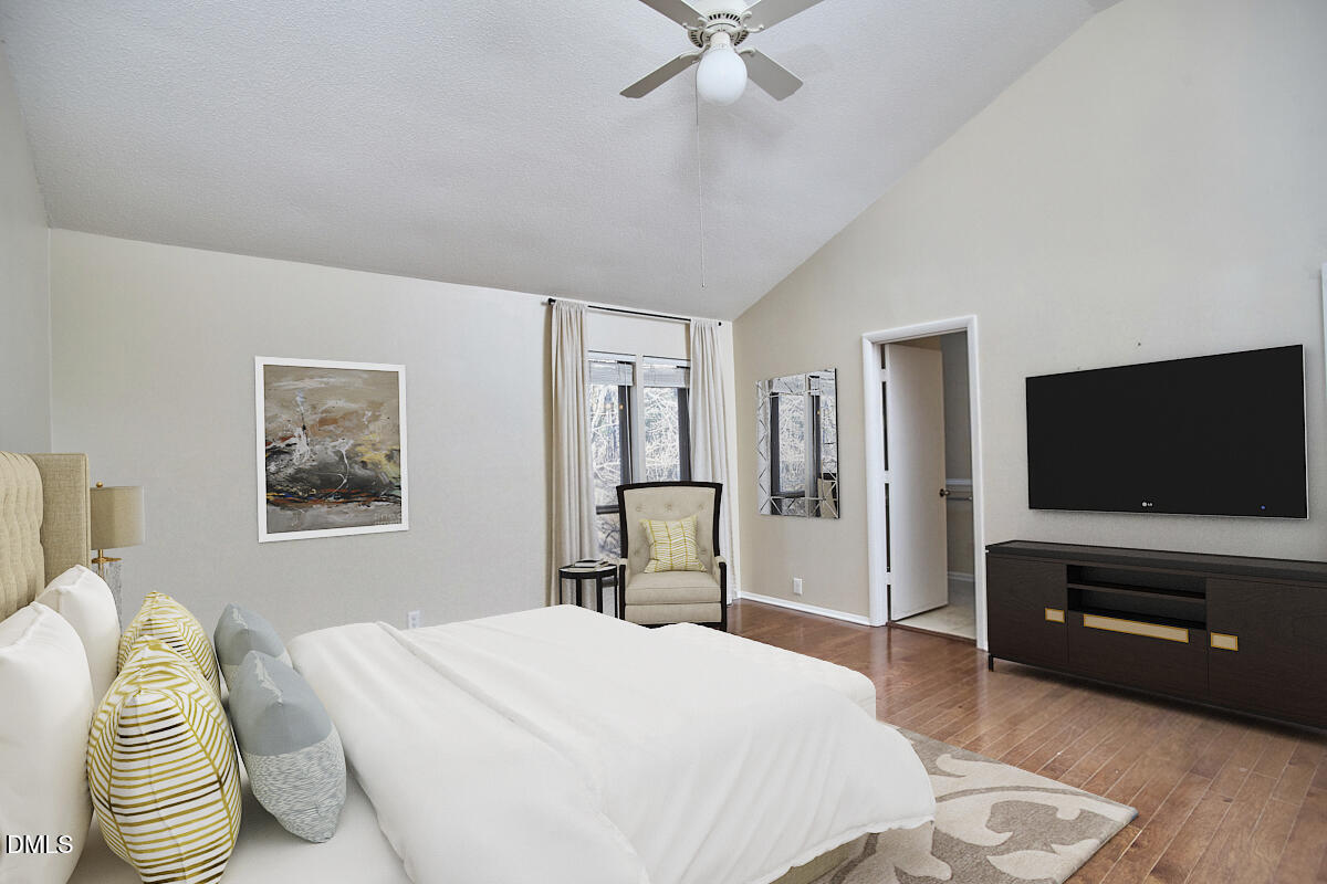 251 Fox Ridge Road Pittsboro, NC 27312 - Photo 23 of 29 a bedroom with a bed and a flat screen tv