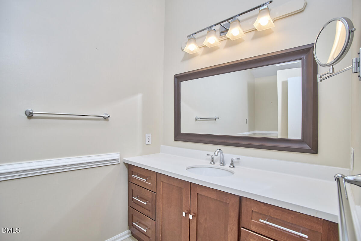 251 Fox Ridge Road Pittsboro, NC 27312 - Photo 24 of 29 a bathroom with a sink vanity and mirror
