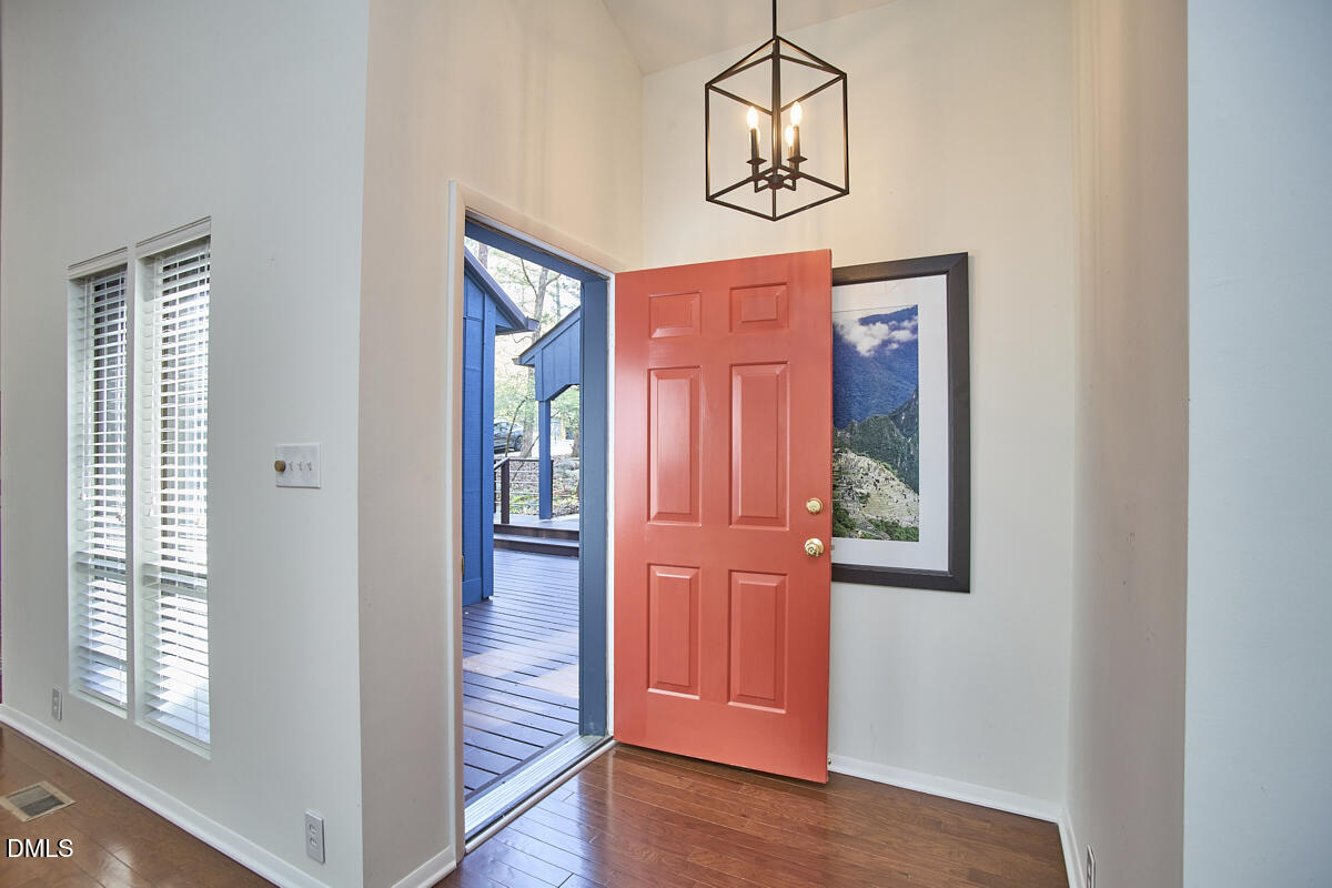 251 Fox Ridge Road Pittsboro, NC 27312 - Photo 8 of 29 an empty room with wooden floor closet and windows