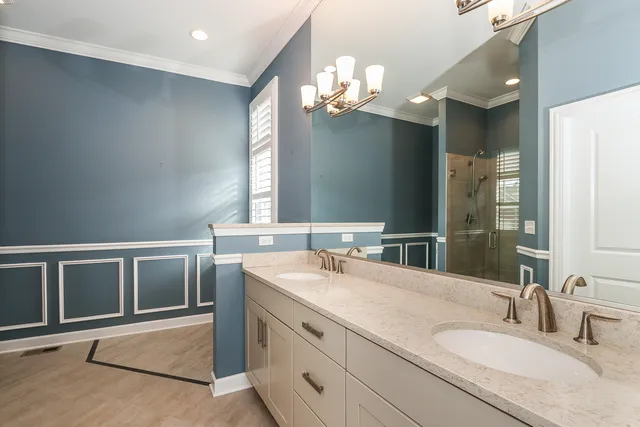 a bathroom with a sink double vanity and a mirror