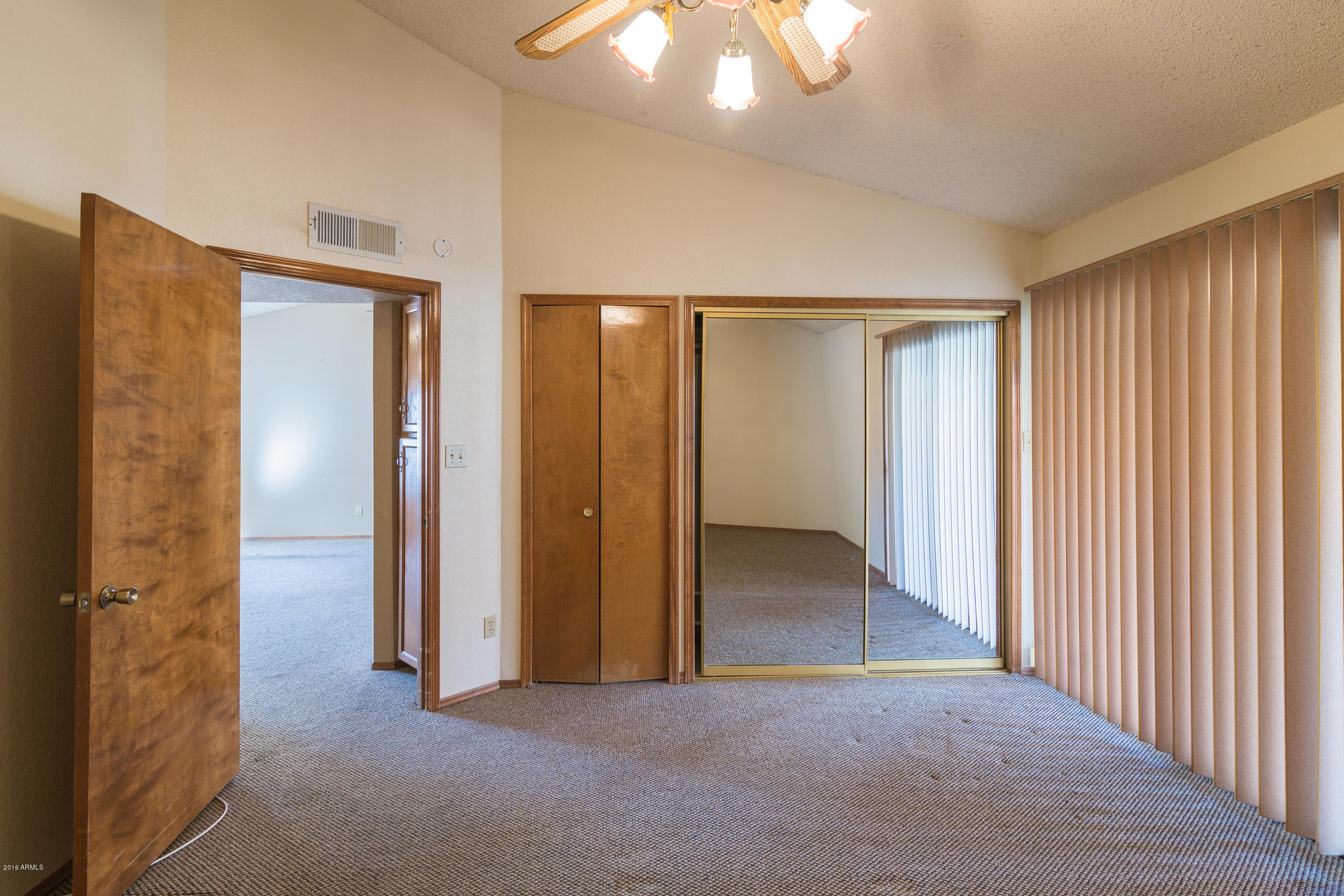 542 South Higley Road, Unit 78 Mesa, AZ 85206 - Photo 11 of 17 an empty room with windows and closet