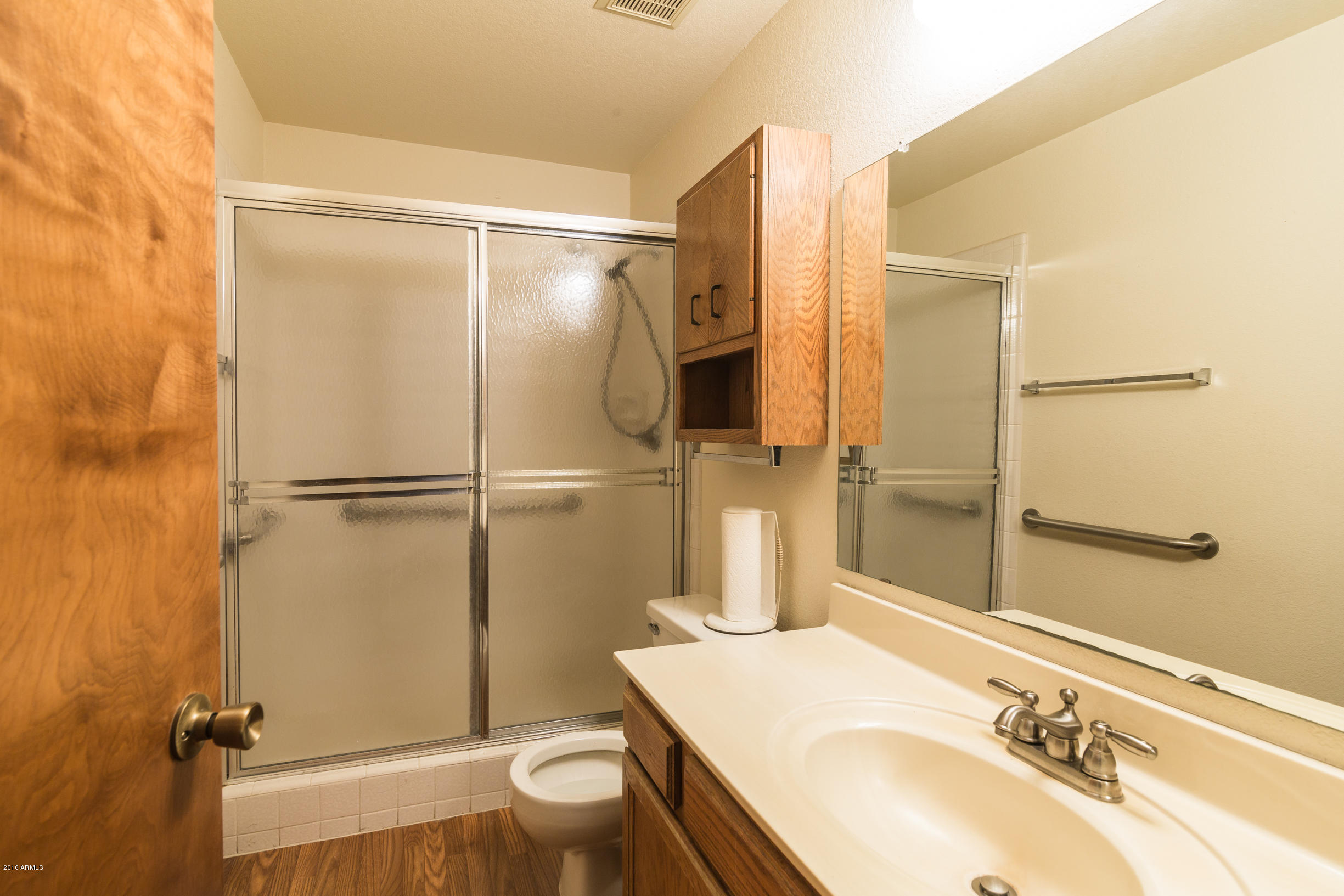 542 South Higley Road, Unit 78 Mesa, AZ 85206 - Photo 12 of 17 a bathroom with a granite countertop sink toilet and shower